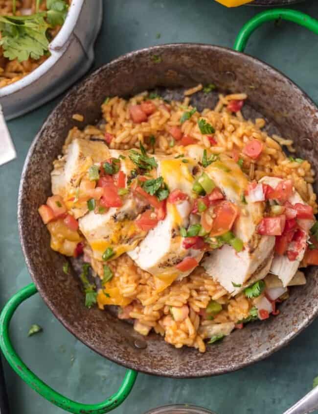 FIESTA LIME CHICKEN is our favorite easy grilled Summer meal! Served on a bed of Mexican rice and topped with lime ranch, pico de gallo, and tortilla strips; this flavor can't be beat!
