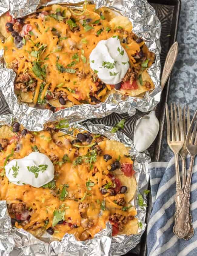 We love throwing these FOIL PACKET NACHOS on the grill any time of year! Loaded with beef, tomatoes, green chiles (and more), and covered in melty cheese. Obsessed.