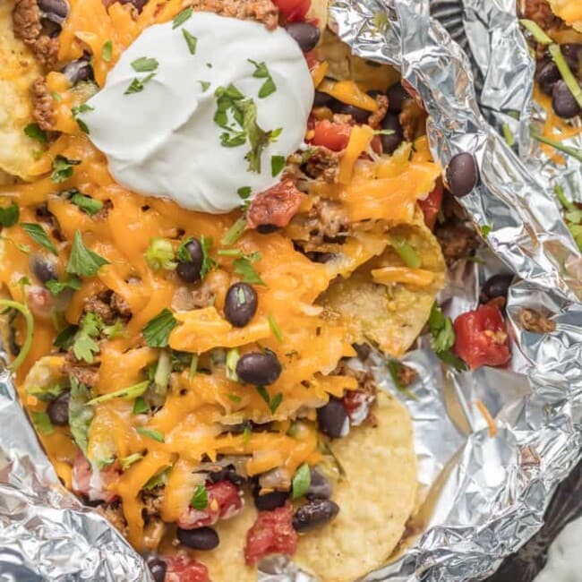 foil packet nachos with a dollop of sour cream