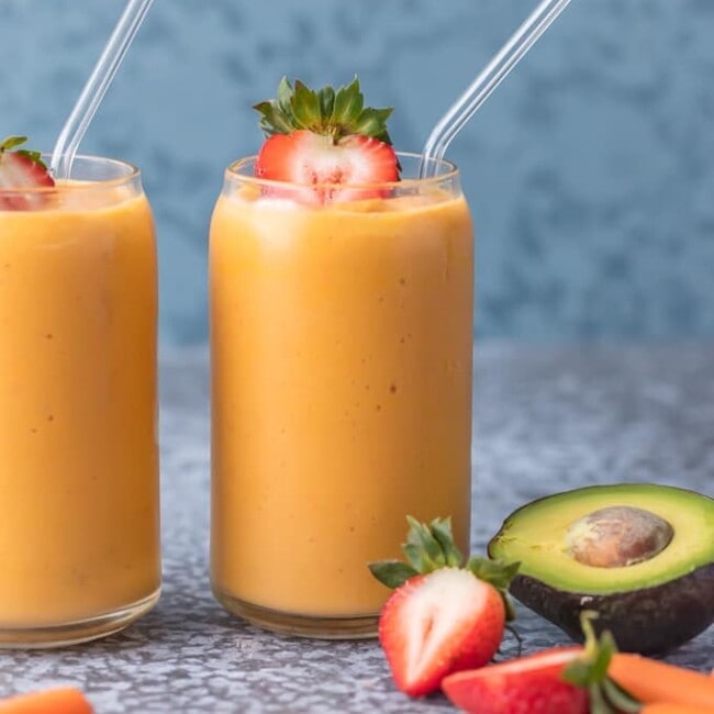This Coconut Water Smoothie is full of delicious ingredients like coconut water, strawberries, mangoes, carrots, and avocado! Sip your way to beautiful skin with this healthy smoothie recipe!