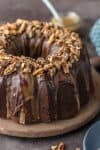 Turtle Brownie Cake is a chocolate lovers dream. Turtle Cake is a dense and moist chocolate brownie cake with walnuts and topped with the most incredible ganache and caramel drizzle. It simply doesn't get better than this Brownie Cake! Crave worthy baking!