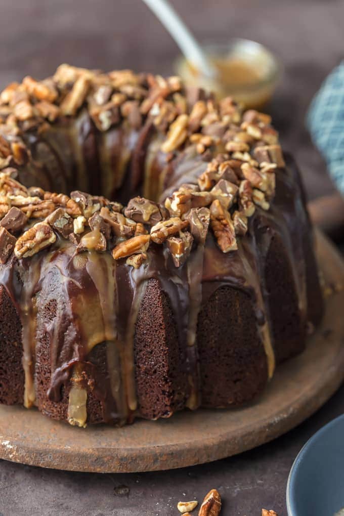 This TURTLE BROWNIE CAKE is a chocolate lovers dream. Dense and moist chocolate cake with walnuts and topped with the most incredible ganache and caramel drizzle. Crave worthy baking!