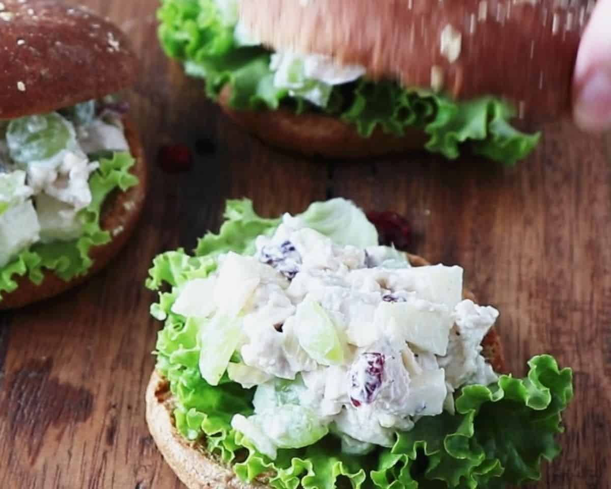 Chicken salad on a bun with lettuce.