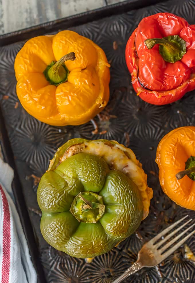 overhead shot of stuffed bell peppers on sheet pan