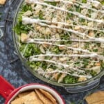 overtop shot of chicken caesar salad dip with crackers