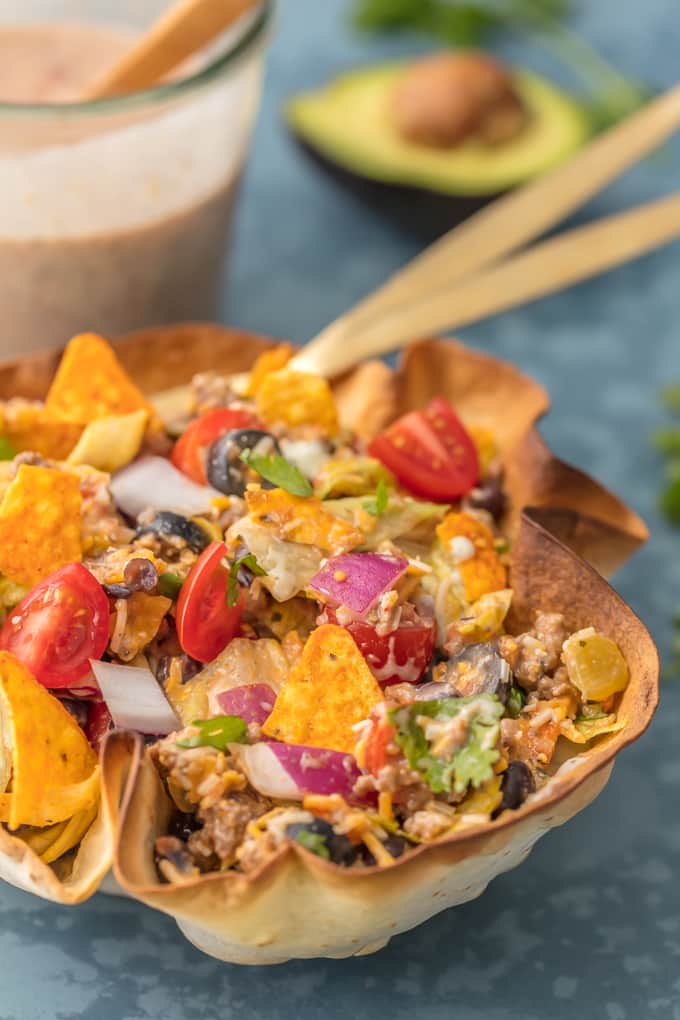 We love this CREAMY TACO SALAD any night of the week. With a homemade tortilla bowl and loaded with all the toppings, it can't be beat.