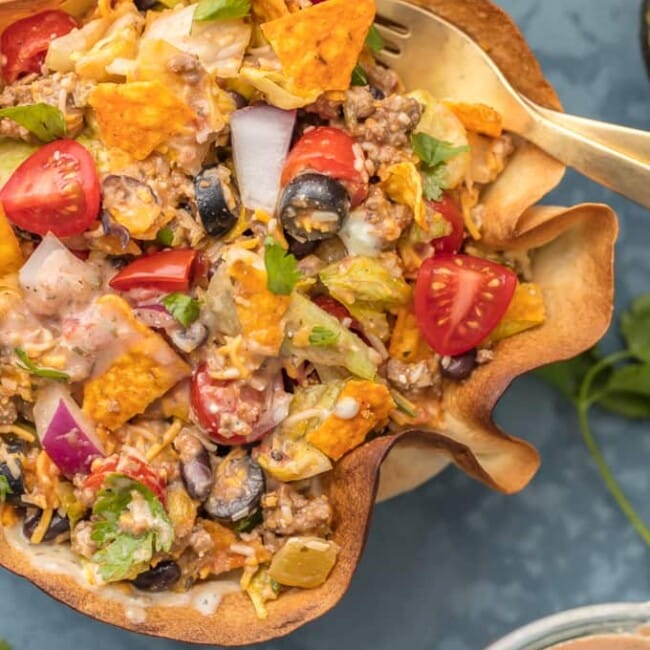 TACO SALAD is one of my favorite weeknight meals. It's simple, fresh, and easy to make. Taco Bowls are like a healthy version of my favorite Mexican dishes! We just love these CREAMY TACO SALAD BOWLS any night of the week. With a homemade tortilla bowl and loaded with all the toppings, this recipe can't be beat.