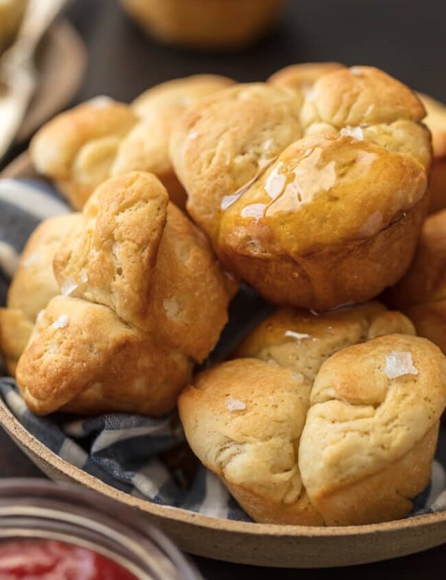 Dinner Rolls are a must make for any family get together, especially the holidays! These Christmas or Thanksgiving Dinner Rolls can be prepped ahead of time and stored in the fridge (Ice Box Rolls!) until ready to bake. This Dinner Roll Recipe is the perfect easy homemade bread for every occasion, especially a sit down dinner with those you love. Impress your holiday guests with these delicious bread recipe. 