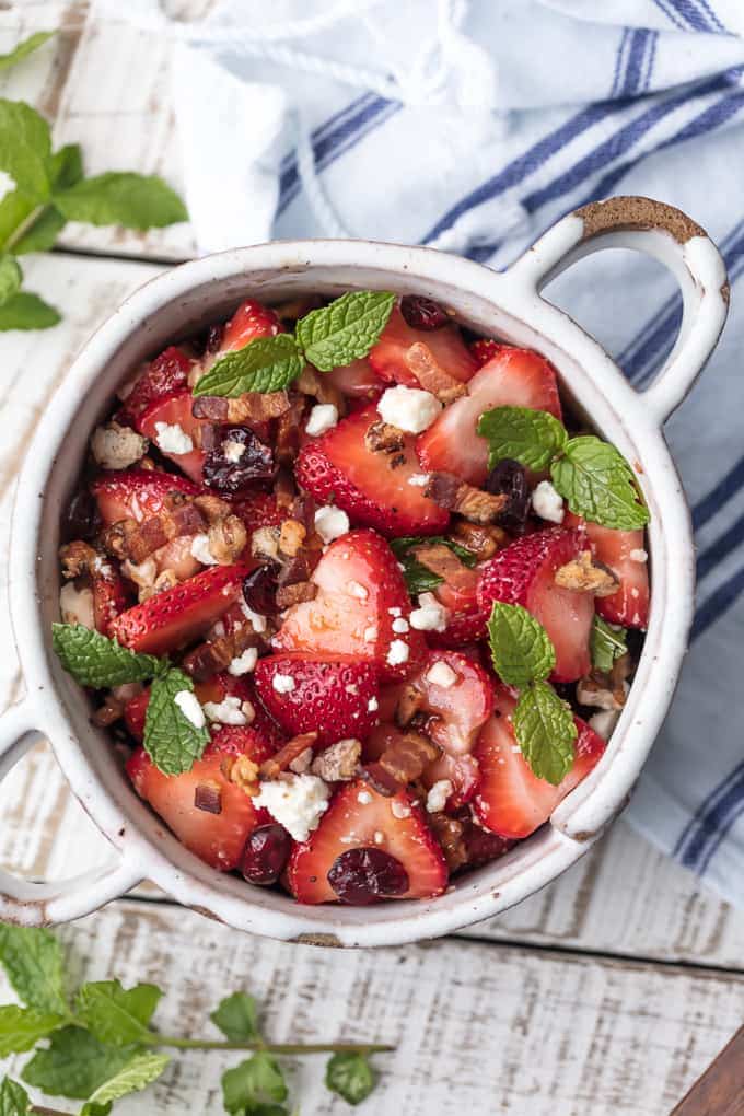 Strawberry Bacon Salad with feta, dried cranberries, pecans, mint, and balsamic vinaigrette