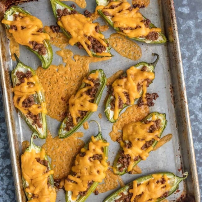 stuffed jalapeno poppers on cookie sheet