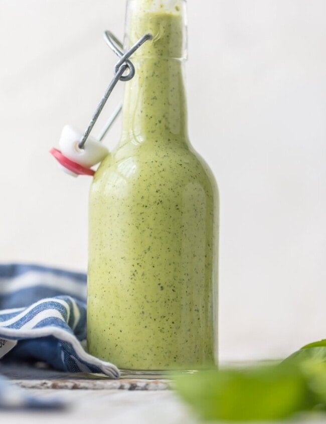 Peruvian Green Sauce (Aji Sauce) is our go-to sauce for anything and everything. We love this Peruvian Green Sauce Recipe on chicken, steak, grilled veggies, salad, and more. SO DARN GOOD. Aji Verde (Green Sauce) is loaded with jalapenos, basil, parmesan, ginger, honey, garlic, lime, and more!