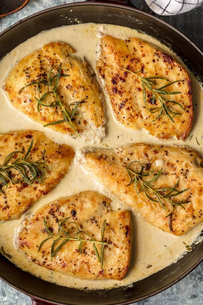 This CREAMY WHITE WINE DIJON CHICKEN with rosemary is sure to make the weekly rotation on your dinner menu. Utterly delicious, easy, and sure to please.