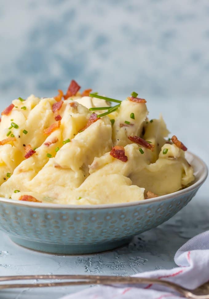 Every Thanksgiving table needs BACON GOAT CHEESE MASHED POTATOES! These are our favorite mashed potatoes and are always a crowd pleaser. So creamy, flavorful, and delicious. THE BEST cheesy mashed potato recipe!