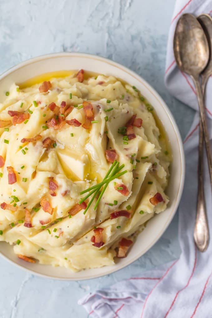 Every Thanksgiving table needs BACON GOAT CHEESE MASHED POTATOES! These are our favorite mashed potatoes and are always a crowd pleaser. So creamy, flavorful, and delicious. THE BEST cheesy mashed potato recipe!