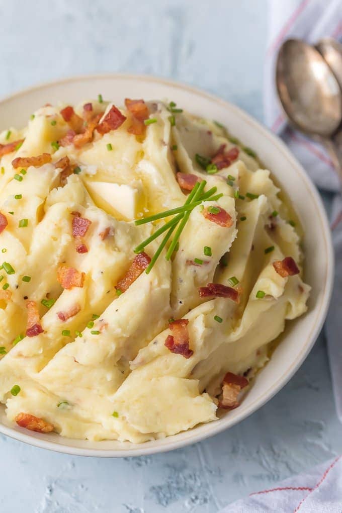 Goat cheese mashed potatoes with bacon in a white bowl