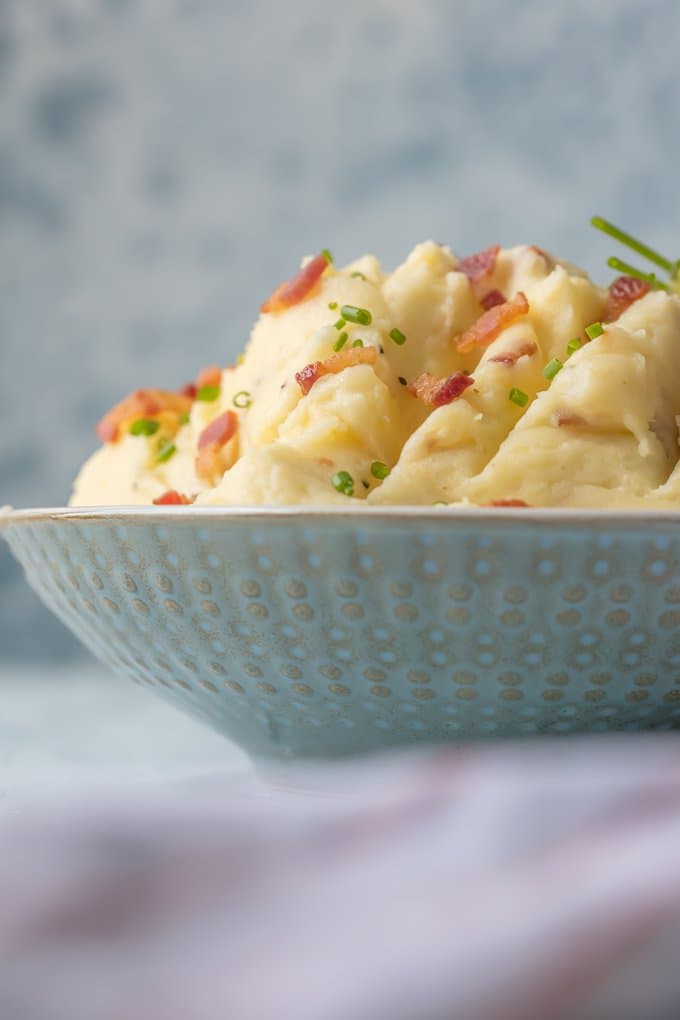Every Thanksgiving table needs BACON GOAT CHEESE MASHED POTATOES! These are our favorite mashed potatoes and are always a crowd pleaser. So creamy, flavorful, and delicious. THE BEST cheesy mashed potato recipe!