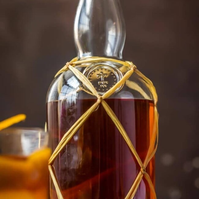 HOMEMADE SPICED RUM is so much easier than you think, and will blow you away with all the flavor! So much tastier than buying in store. This Homemade Spiced Rum makes an awesome DIY Christmas gift! cocktail photography drink photography cookbook photographer