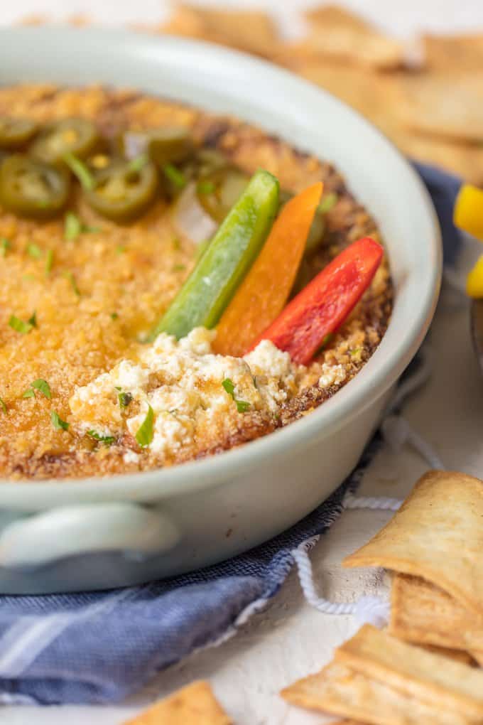 Hot dip recipe with jalapenos and bell peppers on top