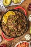 The amazing SANGRIA PORK CARNITAS are made in a slow cooker and finished in a skillet, making them crispy, juicy, and unique. The flavor is out of this world! Eat them on their own, over rice, on nachos, or as tacos! You can't go wrong, except for not trying this recipe.