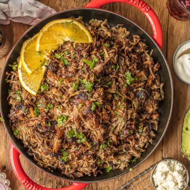 The amazing SANGRIA PORK CARNITAS are made in a slow cooker and finished in a skillet, making them crispy, juicy, and unique. The flavor is out of this world! Eat them on their own, over rice, on nachos, or as tacos! You can't go wrong, except for not trying this recipe.