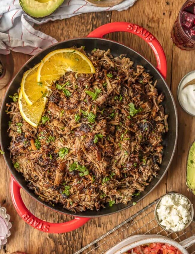 The amazing SANGRIA PORK CARNITAS are made in a slow cooker and finished in a skillet, making them crispy, juicy, and unique. The flavor is out of this world! Eat them on their own, over rice, on nachos, or as tacos! You can't go wrong, except for not trying this recipe.