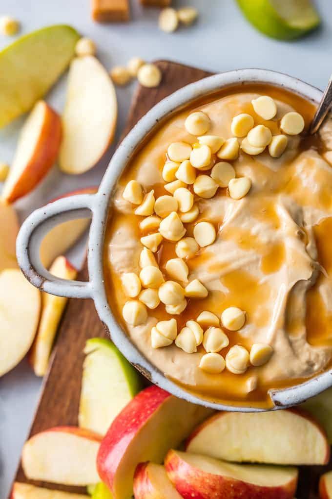 Caramel Apple Dip with apples surrounding it