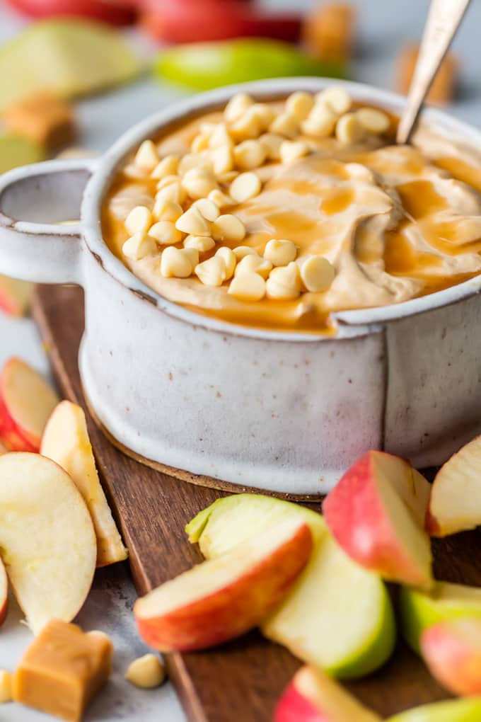 creamy caramel apple dip in a bowl with apples