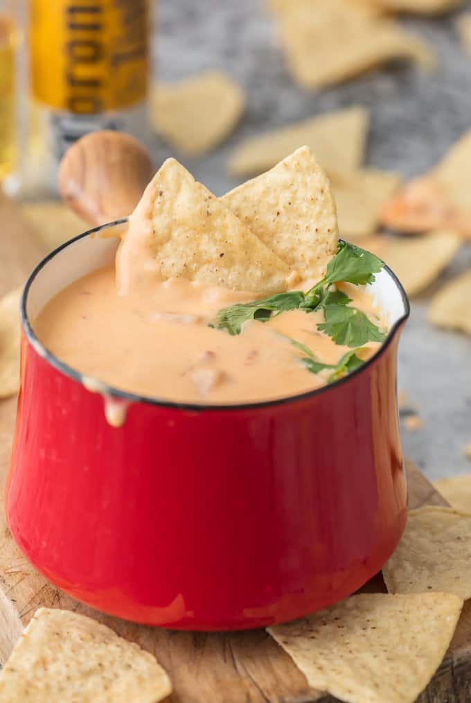 Red bowl filled with beer queso dip