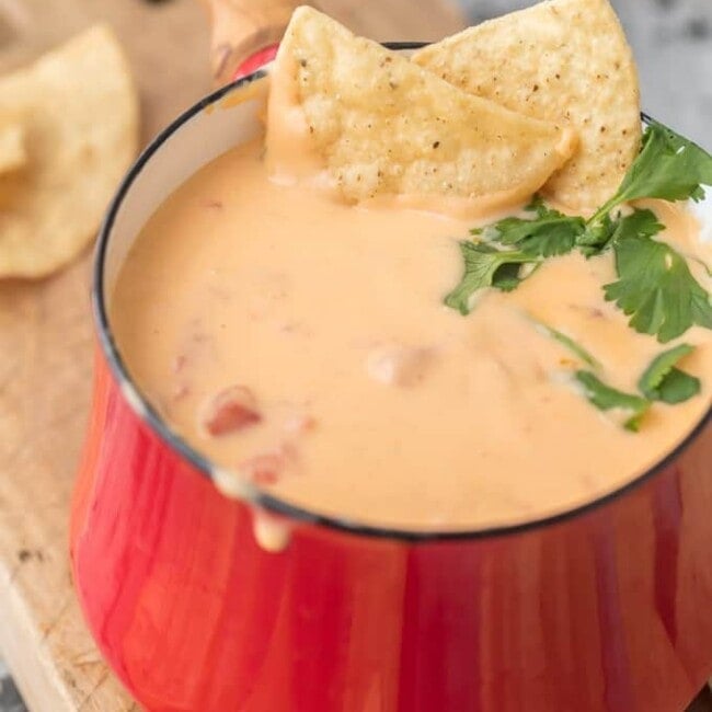 Beer Cheese Dip has been around for ages but this 4 INGREDIENT BEER CAN QUESO is our absolute favorite EASY beer queso dip! This Queso Dip with Cream Cheese is made with just beer, shredded cheese, and spicy diced tomatoes, making it a recipe you will make again and again. Game Day has never been more delicious (or easier) than with this Beer Cheese Dip Recipe.