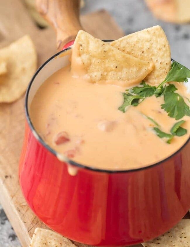 Beer Cheese Dip has been around for ages but this 4 INGREDIENT BEER CAN QUESO is our absolute favorite EASY beer queso dip! This Queso Dip with Cream Cheese is made with just beer, shredded cheese, and spicy diced tomatoes, making it a recipe you will make again and again. Game Day has never been more delicious (or easier) than with this Beer Cheese Dip Recipe.
