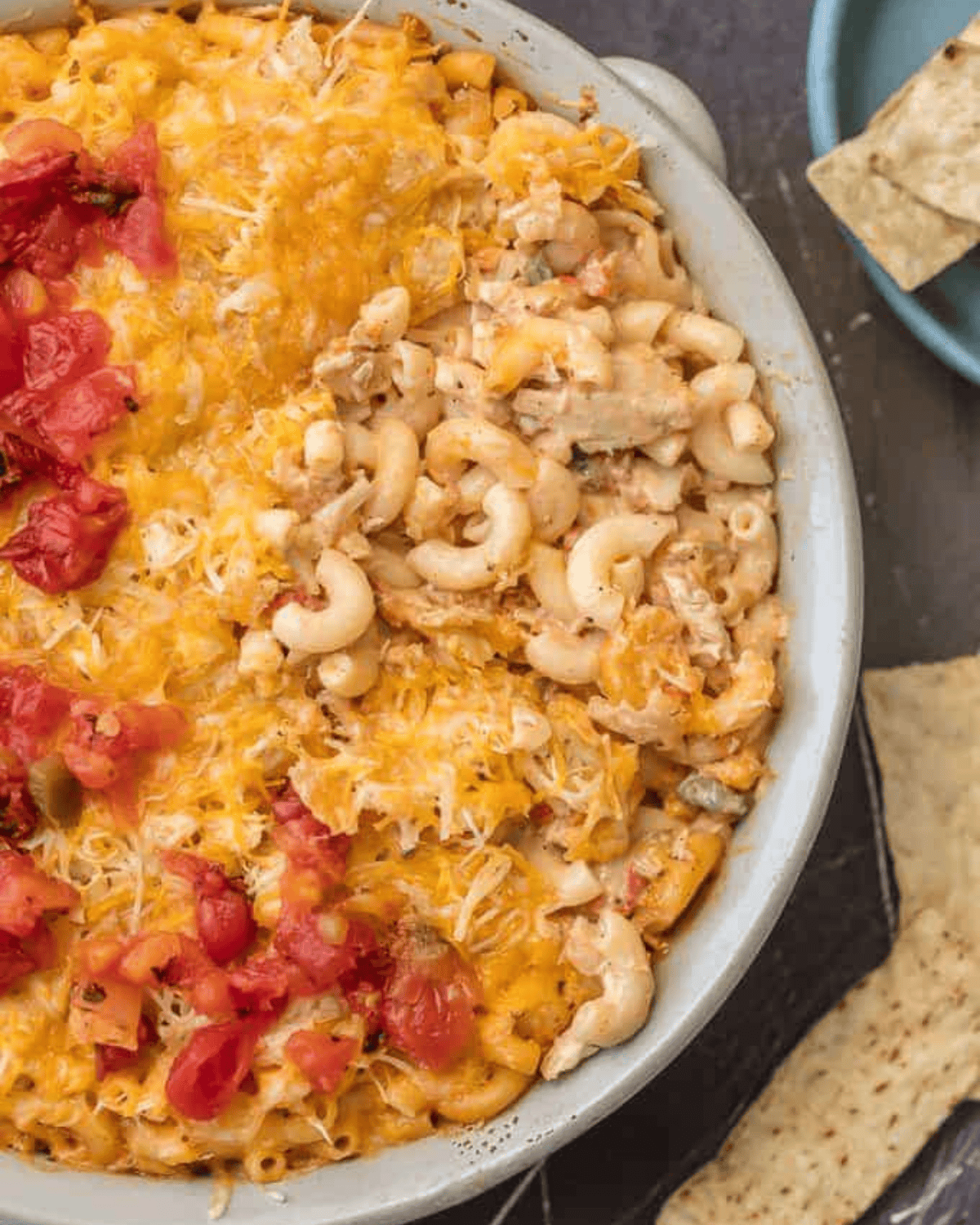 KING RANCH CHICKEN MAC AND CHEESE is a delicious twist on a classic. I wanted to make a fun King Ranch Chicken Recipe that's filled with all those amazing ingredients that I love. This Chicken Mac and Cheese Casserole is loaded with creamy cheese, spicy tomatoes, chunky chicken, and so much more. It will be a family favorite from the first time you make it. King Ranch chicken mac and cheese casserole.