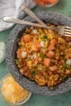 This EASY CHEESY TEX MEX RICE is our favorite Mexican side dish! We are obsessed with this cheesy rice loaded with all the best ingredients.