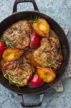 Honey Pork Chops with Pears and Bourbon are the perfect fall comfort food. We are obsessed with this Pan Fried Pork Chops Recipe with its Fall flavors and decadent comfort food appeal! These Honey Pork Chops are rubbed with fragrant herbs and are the perfect mix of savory and sweet when combined with the bourbon and fresh pears. This is the best pork chops recipe for fall!
