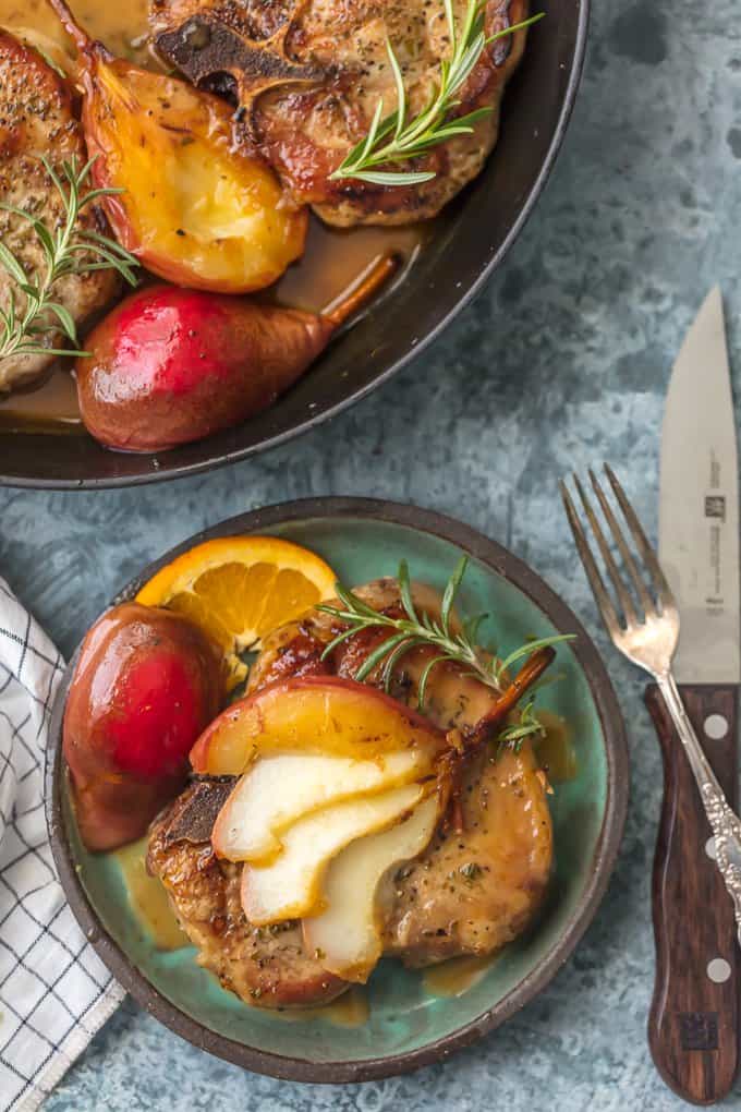 Honey Pork Chops on a plate topped with sliced bourbon pears