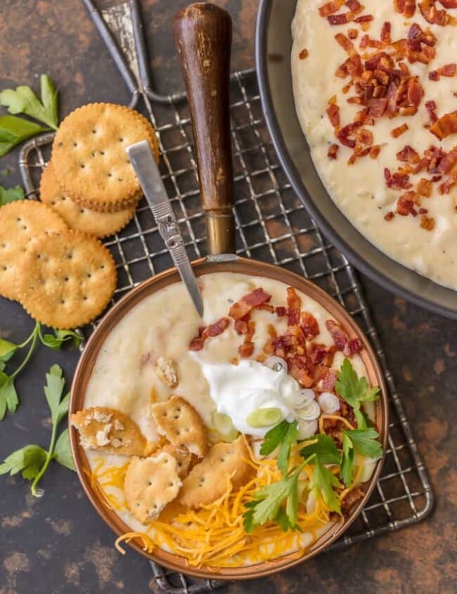 Loaded Baked Potato Soup is one of the best comfort food soups for a cold Winter night! It doesn't get more comforting than this LOADED BAKED POTATO SOUP RECIPE. This creamy hearty potato soup is loaded with bacon, potatoes, cheese, sour cream, and so much more. Loaded Potato Soup warms the soul. 
