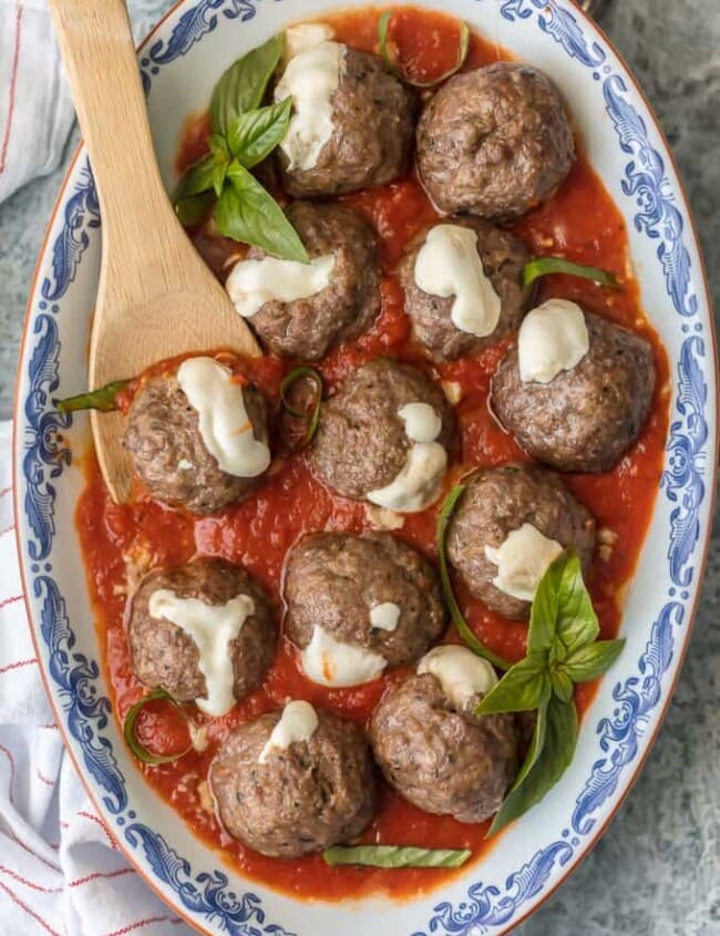 MOZZARELLA STUFFED MEATBALLS are the ultimate appetizer! Theses Italian meatballs are stuffed with whole milk mozzarella and they are oh so juicy and tender. You better make a double batch of these Mozzarella Meatballs if you want them to last! 