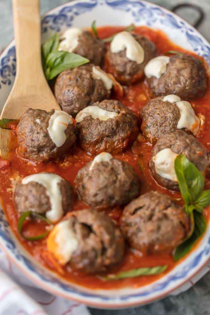 Mozzarella Meatballs bathed in marinara sauce in large serving dish