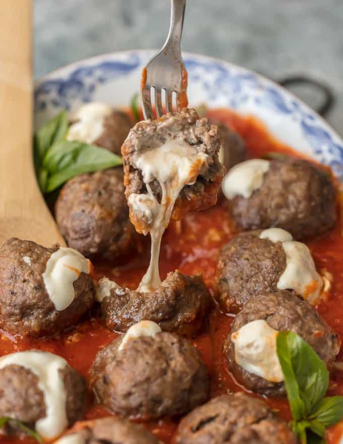 Italian Meatball on a fork with cheese dripping out