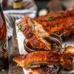 oven bake dribs on a platter dipped in sauce
