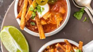 Slow Cooker Chicken Tortilla Soup (Healthy Crockpot Tortilla Soup) is my absolute FAVORITE SOUP recipe for Winter! This Chicken Tortilla Soup is spicy, easy, and delicious. This Healthy Chicken Tortilla Soup is loaded with spices, chicken, tomatoes, green chiles, corn, and more! It's so simple and delicious. Best Chicken Tortilla Soup in a Slow Cooker!