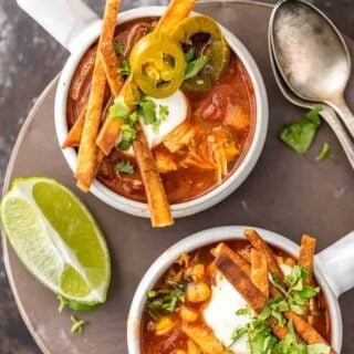 Slow Cooker Chicken Tortilla Soup (Healthy Crockpot Tortilla Soup) is my absolute FAVORITE SOUP recipe for Winter! This Chicken Tortilla Soup is spicy, easy, and delicious. This Healthy Chicken Tortilla Soup is loaded with spices, chicken, tomatoes, green chiles, corn, and more! It's so simple and delicious. Best Chicken Tortilla Soup in a Slow Cooker!