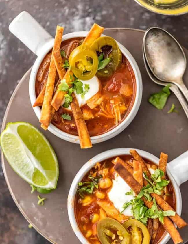 Slow Cooker Chicken Tortilla Soup (Healthy Crockpot Tortilla Soup) is my absolute FAVORITE SOUP recipe for Winter! This Chicken Tortilla Soup is spicy, easy, and delicious. This Healthy Chicken Tortilla Soup is loaded with spices, chicken, tomatoes, green chiles, corn, and more! It's so simple and delicious. Best Chicken Tortilla Soup in a Slow Cooker!