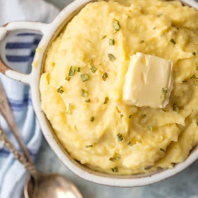 These SLOW COOKER GARLIC BUTTER MASHED POTATOES are the perfect EASY Thanksgiving side dish. So much flavor and none of the fuss.
