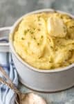 Slow Cooker Mashed Potatoes with Garlic Butter are one of the easiest and best side dishes for any dinner or holiday. These Crock Pot Mashed Potatoes are the perfect EASY Thanksgiving, Christmas, or Easter side dish. So much flavor and none of the fuss. Making this Roasted Garlic Mashed Potatoes recipe in a Crock Pot is SO EASY! Creamed Potatoes for the win!