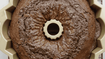 A brownie bundt cake sitting in a pan.