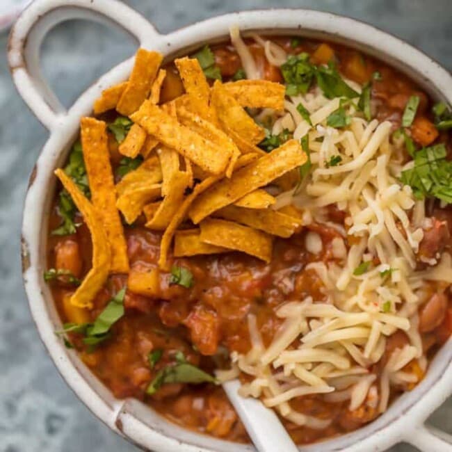 Vegetarian Chili is the best way to enjoy a delicious and healthy Vegan Chili Recipe! This is the  BEST VEGETARIAN CHILI and it will knock your socks off. I never knew I could not only make an Easy Vegetarian Chili recipe but also LOVE it. Buckle up because this is the best Vegan Chili Ever!