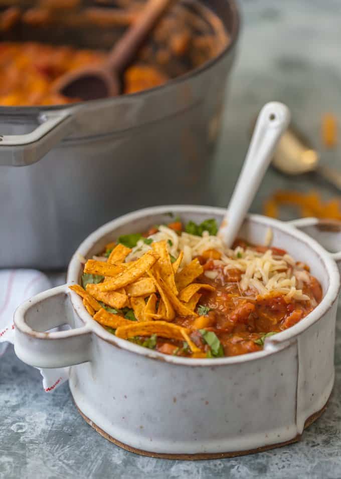 Vegetarian Chili topped with tortilla strips, cilantro, and cheese