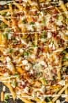 Nothing makes game day delicious more than 3 CHEESE BACON RANCH FRIES. This easy and fun appetizer takes crispy fries and tops them with ranch seasoning, bacon, cheddar, mozzarella, and feta.