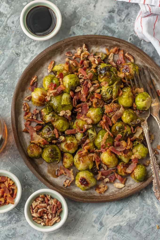 Balsamic Brussels Sprouts with Bacon and Pecans on a plate with forks
