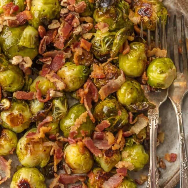These CRUNCHY BACON PECAN BALSAMIC BRUSSELS SPROUTS are the ultimate way to eat veggies this Thanksgiving. Everyone (even the kids) loves brussels sprouts when they're cooked with this much flavor.